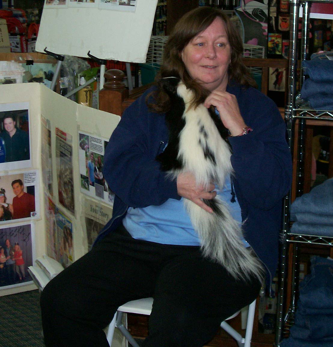 Photo of Renee Pearlstein and one of her skunks